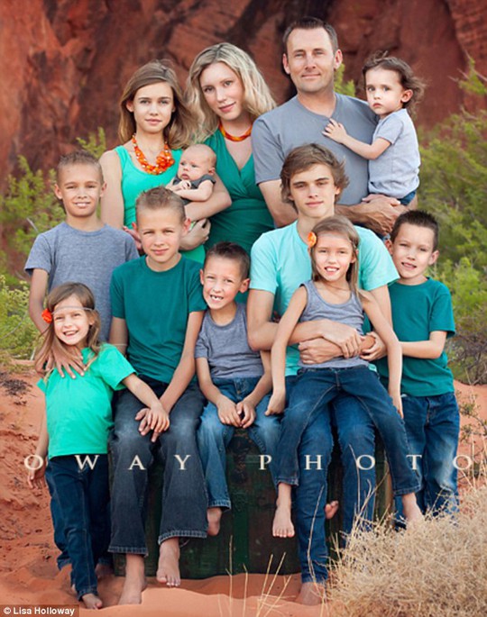 Family matters: Ms Holloway pictured with her husband and all ten children 