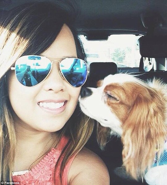 Tragic: Nina Pham, 26, is fighting for her life after contracting Ebola from Thomas Eric Duncan. Here she is pictured with her beloved King Charles Spaniel clled Bentley who is not expected to be destroyed