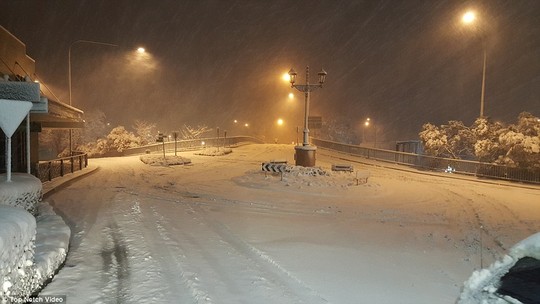 Major roads have been closed in Katoomba, pictured above, as snow and ice cover the asphalt 