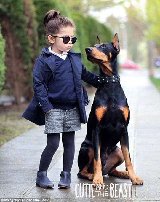 Too cool for school: Four-year-old Siena Prucha and her 80-pound dog Buddha make a stylish pair
