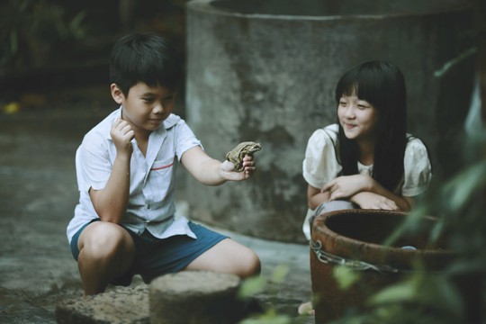 Cảnh trong phim “Tôi đã thấy hoa vàng trên cỏ xanh” đang được người trong giới và công chúng chờ đợi sẽ ra rạp trong tháng 8 tới. (Ảnh do đoàn làm phim cung cấp)