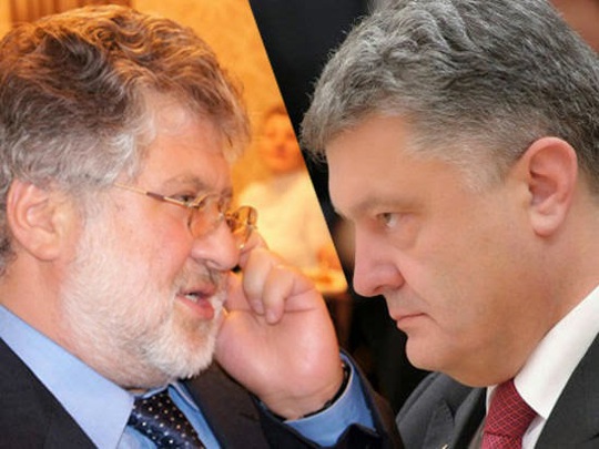 Tổng thống Petro Poroshenko (phải) và Thống đốc Igor Kolomoisky đang đối đầu gay gắt Ảnh: TVZVEZDA.RU