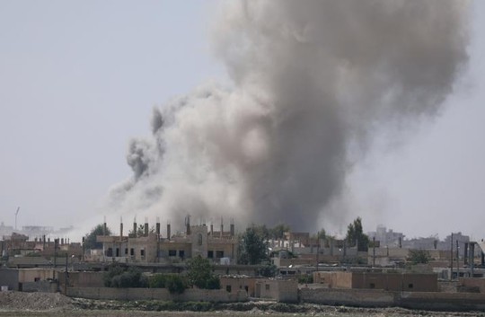 Thảm cảnh ở Raqqa: Ra khỏi nhà là thấy thi thể - Ảnh 2.