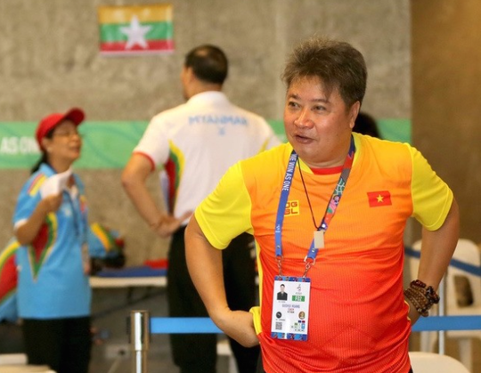 HLV bơi lội Huang Gouhui của đoàn Thể thao Việt Nam qua đời khi đang cách ly - Ảnh 1.