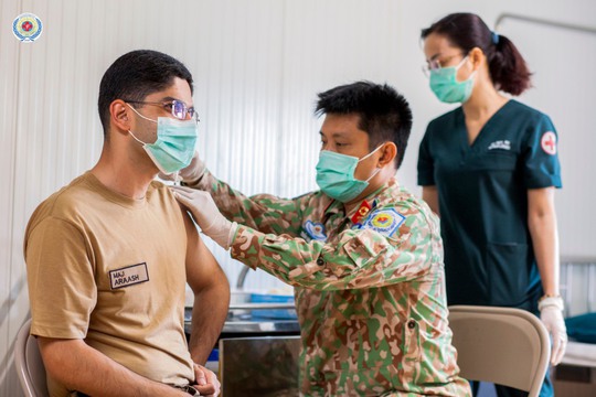 Bệnh viện dã chiến Việt Nam tiêm vắc-xin Covid-19 cho lực lượng mũ nồi xanh quốc tế - Ảnh 6.