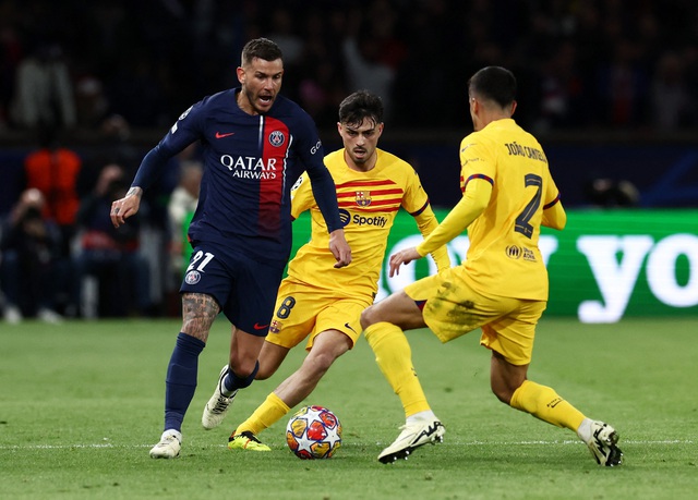 Lucas Hernandez in action with FC Barcelona's Pedri and Joao Cancelo