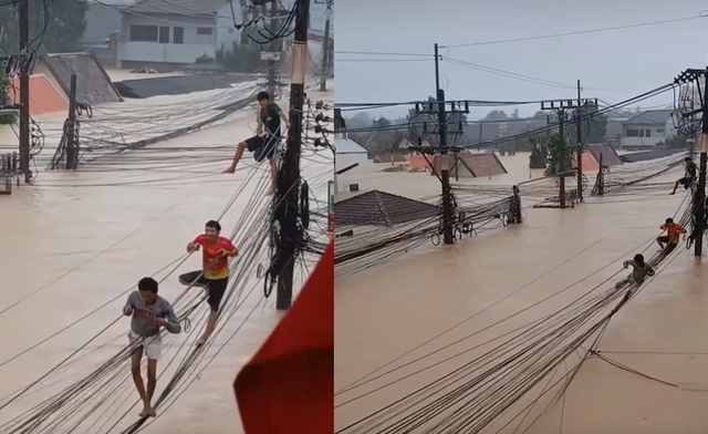 Lũ lịch sử ở Thái Lan: Người dân trèo cáp, phá mái nhà thoát hiểm - Ảnh 1. Lũ lịch sử ở Thái Lan: Người dân trèo cáp, phá mái nhà thoát hiểm - Ảnh 1.