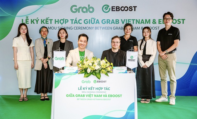 Grab Việt Nam hợp tác với EBOOST thúc đẩy sử dụng xe điện - Ảnh 1.