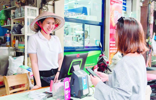 MoMo giúp tiểu thương gỡ nút thắt, chuyển đổi số- Ảnh 1. MoMo giúp tiểu thương gỡ nút thắt, chuyển đổi số- Ảnh 1.