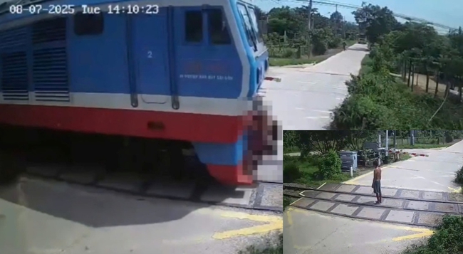 Camera ghi lại khoảnh khắc người đàn ông “đứng im khi tàu hỏa lao tới” - Ảnh 1. Camera ghi lại khoảnh khắc người đàn ông “đứng im khi tàu hỏa lao tới” - Ảnh 1.