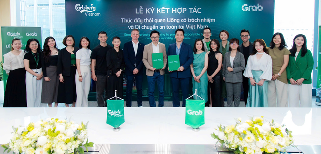Carlsberg Việt Nam và Grab hợp tác thúc đẩy thói quen di chuyển an toàn - Ảnh 1.