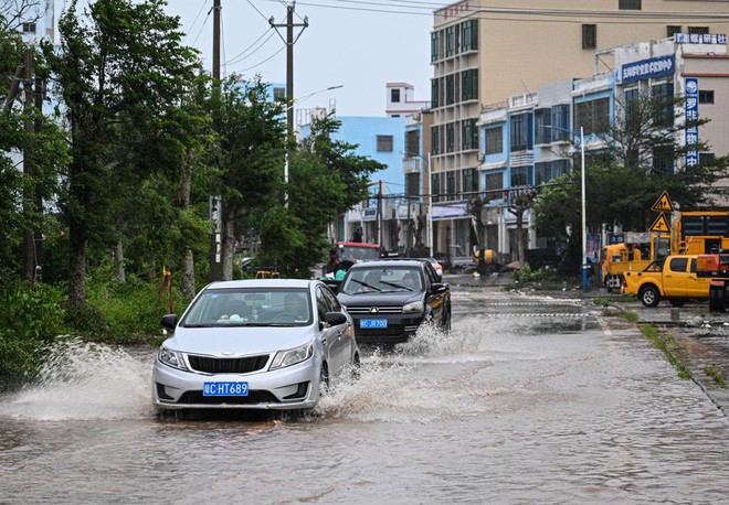 Chùm ảnh: Bão Matmo càn quét Trung Quốc - Ảnh 11.