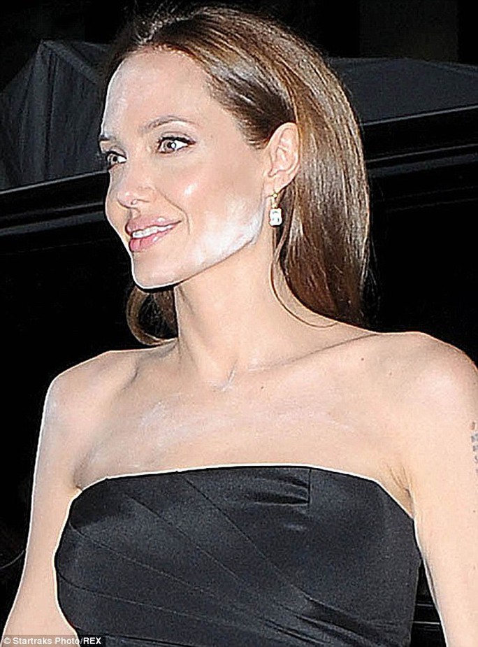 Angelina Jolie's face is smeared with chalk at the movie premiere