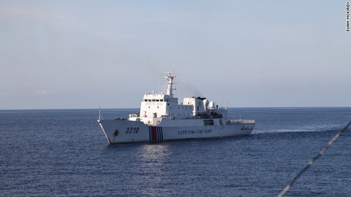 A Chinese Coast Guard vessel closely follows CG 8003.