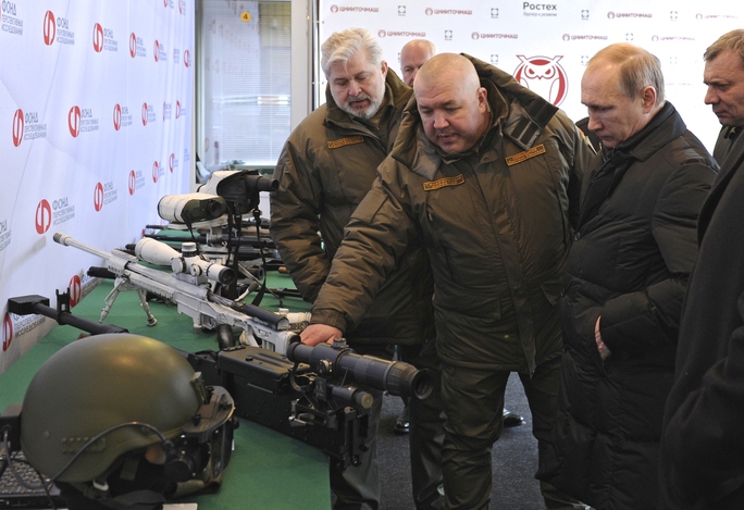 Russian President Vladimir Putin, right front, visits the Central Scientific Research Institute of Precise Mechanical Engineering  in Klimovsk, near...