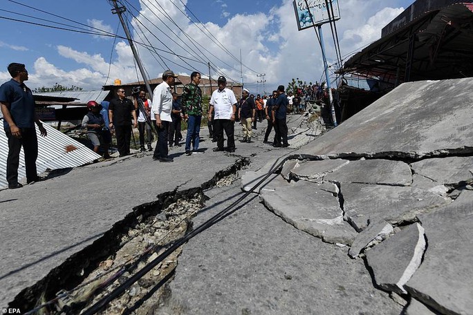 Thảm họa sóng thần Indonesia: Lần tìm người thân trong túi đựng thi thể - Ảnh 9.