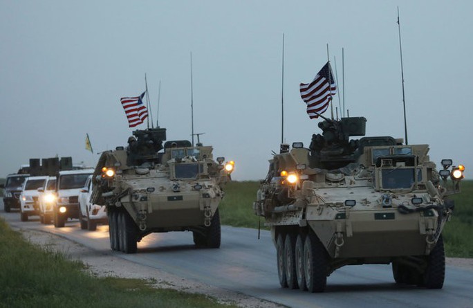 Mỹ đưa 5.000 xe tải chở vũ khí đến Syria - Ảnh 1.