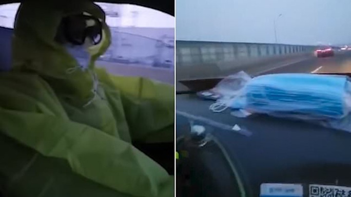Trung Quốc: Tài xế taxi mặc bảo hộ kín mít, người dân đội thùng nhựa ra đường - Ảnh 1.