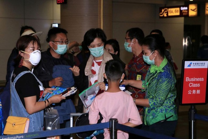 Về quê dịp Tết, hàng trăm ngàn người Trung Quốc mắc kẹt vì virus corona - Ảnh 1.