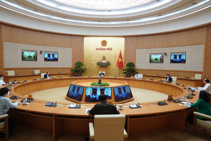 Hà Nội, TP HCM kiến nghị xem xét giảm mức giãn cách xã hội - Ảnh 1.
