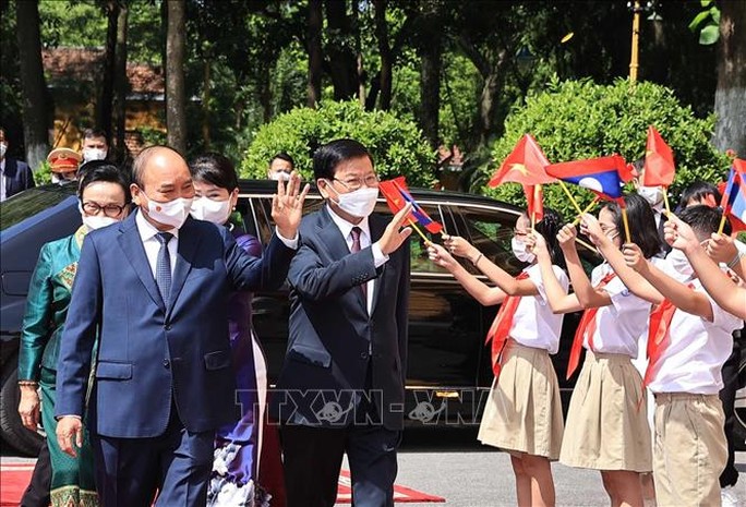 Chủ tịch nước chủ trì lễ đón Tổng Bí thư, Chủ tịch nước Lào - Ảnh 1.