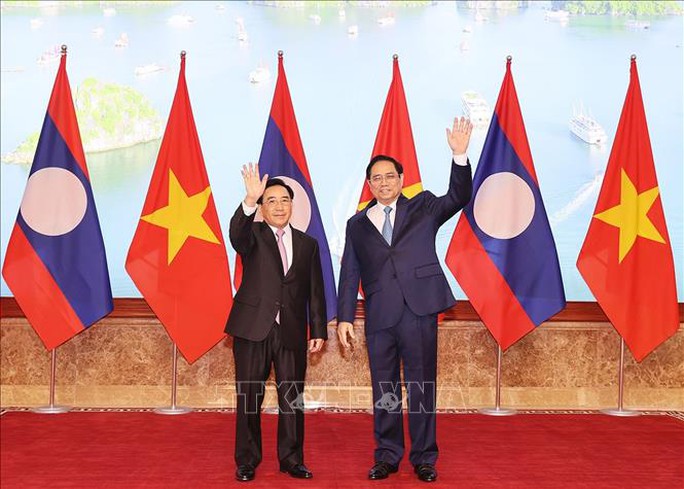 Thủ tướng Phạm Minh Chính đón Thủ tướng Lào thăm chính thức Việt Nam - Ảnh 11.