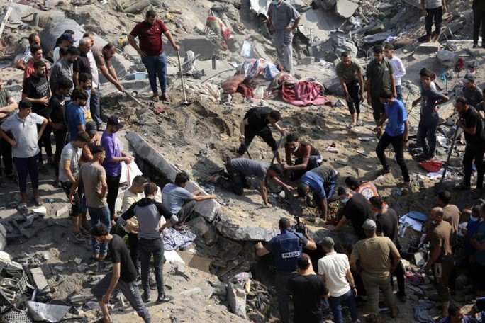 Israel đến cửa ngõ của TP Gaza, đụng độ dữ dội - Ảnh 2. Israel đến cửa ngõ của TP Gaza, đụng độ dữ dội - Ảnh 2.