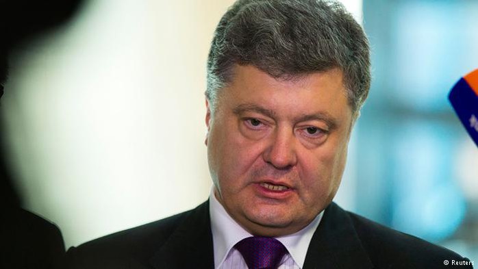 Ukranian presidential candidate Petro Poroshenko (C) talks to the media after talks with Andreas Schockenhoff (not pictured) of the ruling Christian Democratic Union (CDU) party in Berlin, May 7, 2014. Poroshenko urged Europe and the United States to agree on a third wave of sanctions against Russia if the Kremlin supports a referendum organised by separatists in eastern Ukraine on May 11. REUTERS/Thomas Peter) 