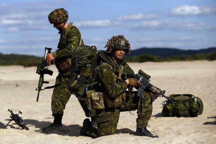 Quân đội Sư đoàn 3 của Canada tham gia cuộc tập trận do NATO tổ chức cùng lữ đoàn Bộ binh Mỹ ở Ba Lan tháng 5-2014. Ảnh: Reuters