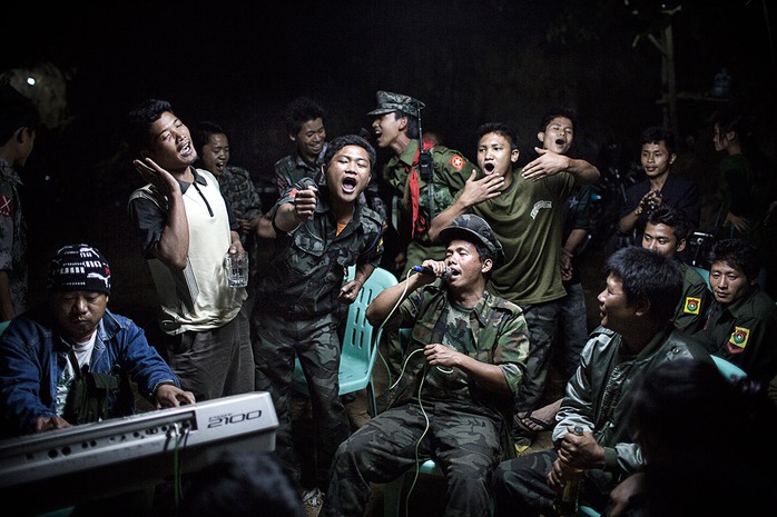 1st Prize Daily Life Single: Julius Schrank. 15 March 2013, Burma. Kachin Independence Army fighters are drinking and celebrating at a funeral of one of their commanders who died the day before. The city is under siege by the Burmese army.