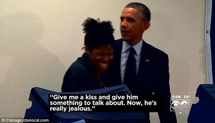 Jealous now? Obama taunted his heckler back by giving his delighted girlfriend a kiss on the cheek