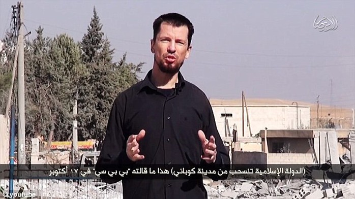 British ISIS hostage John Cantlie has been used as a news reporter from the battle-ravaged city of Kobane in a slickly-produced new video released by the insurgents