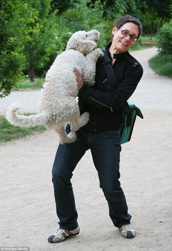 Photographer Julia Christe, 41, of Tettnang, Germany with one of her beloved dogs