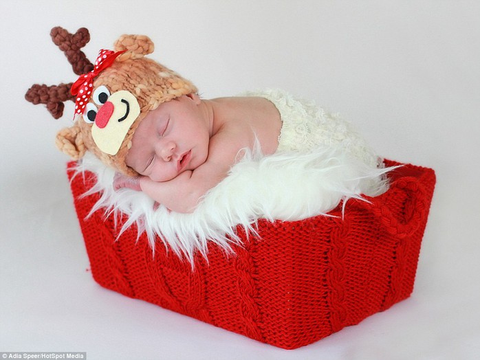 Photographer Adia Speer from New Jersey takes photos of babies in red, white and green, using Santa hats, woolly reindeer horns and carrots. Parents like photos to remind them of their babys first Christmas