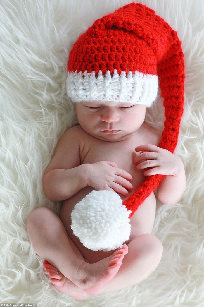 Varying from one to three hours for each photoshoot, Adia photographs the youngsters in Santa hats, munching on Christmas carrots and even posed in a little Christmas baskets. In this picture, Vera, under two weeks old, looks adorable wearing this woolly Santa hat