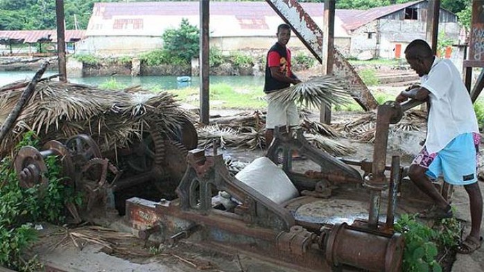 The file photo shows workers at a sugar company in Madagascar.