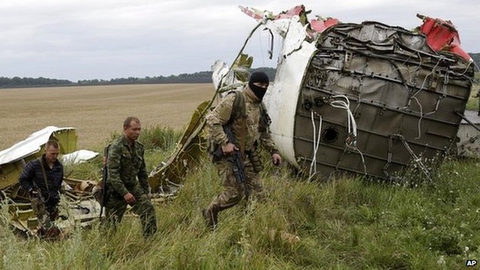 Pro-Russian fighters patrol the site of the crashed Malaysia Airlines plane in eastern Ukraine - 18 July 2014