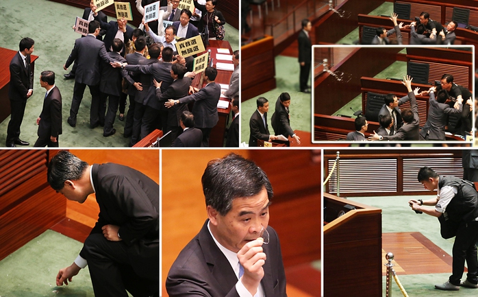 Ông Lương Chấn Anh bị ném ly nước vào người trong cuộc họp Hội đồng lập pháp ngày 3-7. Ảnh: SCMP