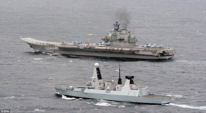 Escort: HMS Dragon (foreground) with the Russian aircraft carrier &apos;Admiral Kuznetsov&apos;, in the English Channel. HMS Dragon tracked and met up with a Russian task group off the coast of Brest as they entered the English Channel yesterday