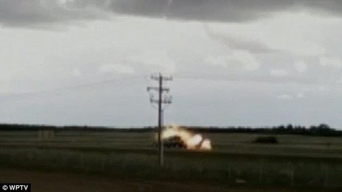 Fireball: Al and Bettys pick up truck bursts into flames as lighting strikes it on an Alberta road