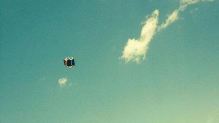 A witness picture of a bounce house blowing through the air in South Glens Falls on Monday, well after children inside had fallen out. Three children were hurt, two seriously. -- PHOTO: POSTSTAR.COM/EMILY BOUCHER
