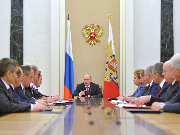 Russian President Vladimir Putin, centre, heads the Security Council in Moscows Kremlin on Friday. 