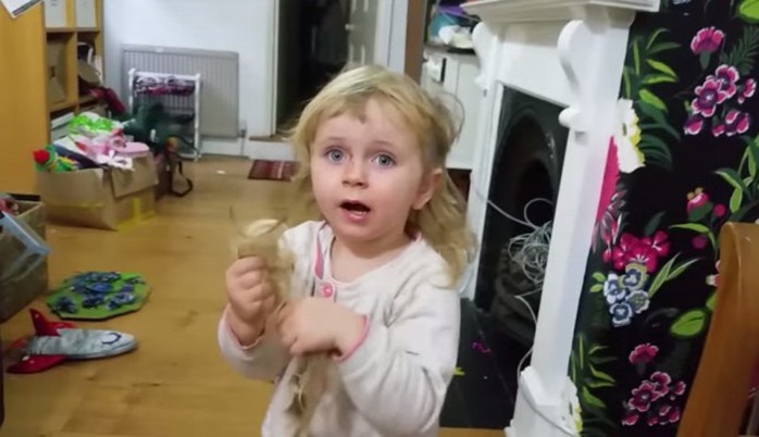 Kid cuts her own hair, totally styles it out