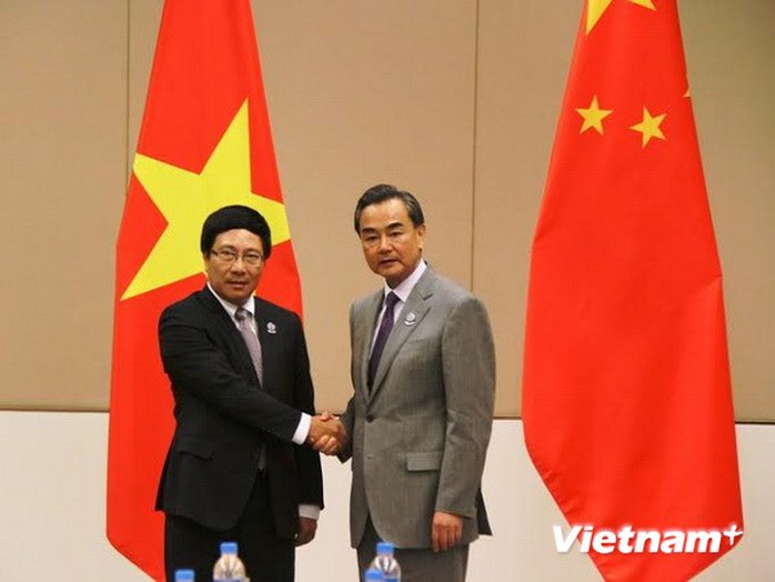 Phó Thủ tướng, Bộ trưởng Ngoại giao Việt Nam Phạm Bình Minh và Bộ trưởng Ngoại giao Trung Quốc Vương Nghị. Ảnh: Việt Hải/Vietnam+