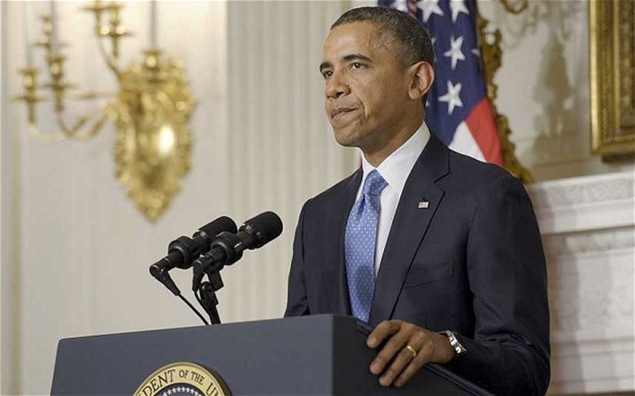 Tổng thống Obama cảnh báo sẽ trừng phạt nặng Iran nếu có bất kỳ vi phạm nào. Ảnh: AP