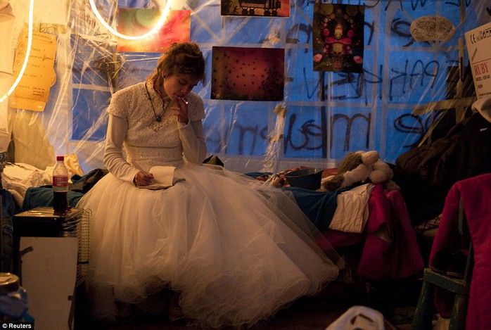 Occupy Amsterdam demonstrator Eveline Constance Heijkamp, 22, prepares for her wedding in a tent on the Beursplein in Amsterdam on November 19, 2011