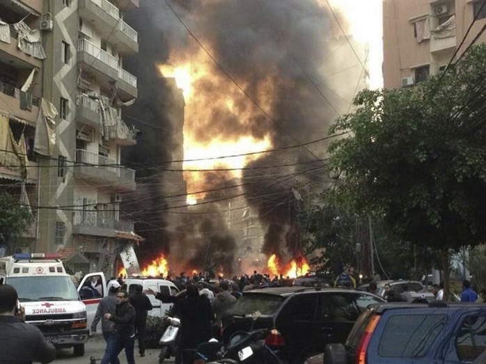 Fire and smoke is seen at the site of the explosion in Beirut's southern suburbs