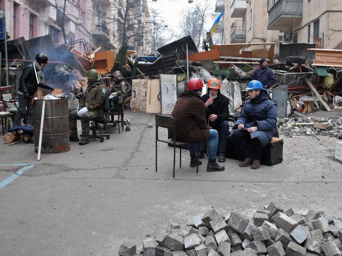 Protesters rest at barricades in Kiev.