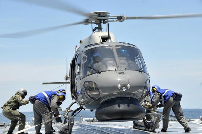 The Royal Malaysian Navy, a Royal Malaysian Navy Fennec helicopter prepares to depart to aid in the search and rescue efforts for the missing Malaysia Airlines flight MH370 over the Straits of Malacca in this handout photograph received on March 13, 2014. REUTERS/The Royal Malaysian Navy/Handout via Reuters