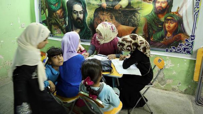 Girls study at an orphanage in Baghdad. A new law set to be introduced in Iraq could see girls as young as nine being married.